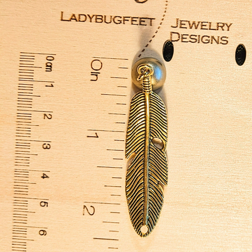 Gold Curved Feather Pendant