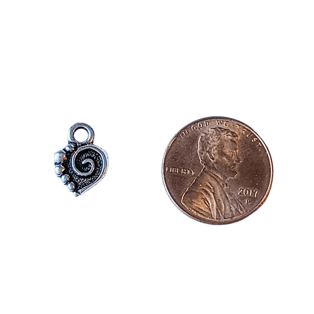 Silver Tierra Cast Heart Charm